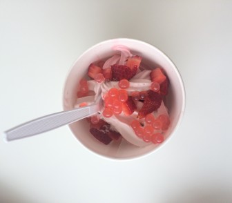 A mix of strawberry and raspberry ice cream topped with fresh strawberries and strawberries flavored boba beads. Photo by Mackenzie Lewis
