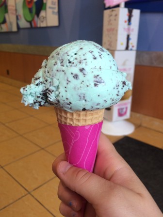A scoop of Mint Chocolate Chip ice cream in a sugar cone. Photo by Mackenzie Lewis