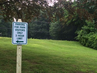 These signs now are placed along the road through Mead Park, an effort to rid the parking areas of people taking advantage. Credit: Michael Dinan