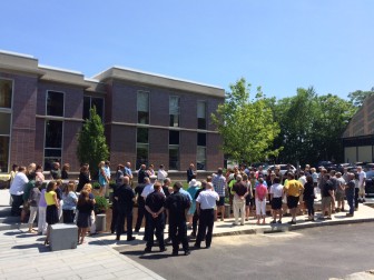 More than 100 people attended a moving ceremony where a sugar maple tree planted outside of the Town Hall addition was dedicated to longtime DPW worker Ben Olmstead, a beloved Norwalk man who worked for the town for more than 30 years and died following an accident last summer. Credit: Michael Dinan