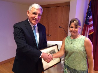Immediate Past President of the New Canaan Library Board of Directors, Christian Le Bris, with Library Director Lisa Oldham, just after the board's annual meeting, held July 14, 2015 in the Lamb Room. Credit: Michael Dinan
