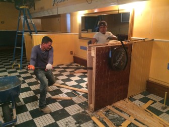 A crew works on the interior demolition of the bar area at Gates. A reopening under the same name and new ownership is planned for mid-fall. Credit: Michael Dinan
