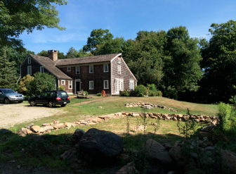 A wider view looking roughly North-Northwest past the proposed barn site to the Robinsons' saltbox home. The original 1737 structure is on the left, and the family used materials as closely resembling the original timber as possible to create its more modern addition off of the back—an example of historic preservation widely heralded by local experts. Credit: Michael Dinan