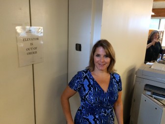 New Canaan Library Director Lisa Oldham stands by the out-of-commission elevator on a recent afternoon. Credit: Michael Dinan