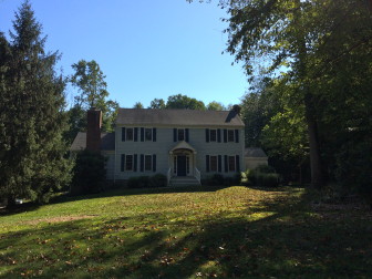 This 1976-built Colonial at 242 Jelliff Mill Road sits on two acres and includes 2,614 square feet of living space. It sold in September 2015 for $870,000. Credit: Michael Dinan