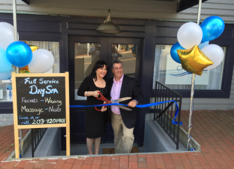 Alicia Brandfellner, owner of Ciel Eau day spa by the corner of East Avenue at Main Street, and First Selectman Rob Mallozzi at the official ribbon-cutting for the new business, on Sept. 21, 2015. Contributed