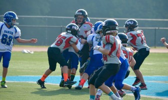 Dominic Rasso (#76) with a hard tackle. Credit: Diane Rasso