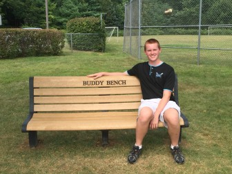 New Canaan's Charlie Sokolowski on a buddy bench he installed as part of his Eagle Scout project. Contributed
