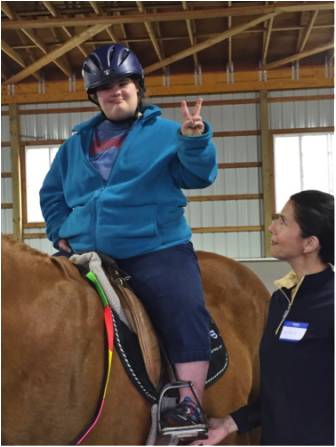 DS shares a peace sign while riding Jack. New Canaan Mounted Troop photo