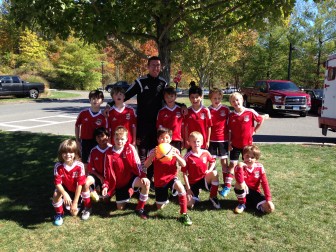 U9 White New Canaan FC Team Picture with Coach Matt Taylor (Eric Huang and Alex Russey missing). Contributed