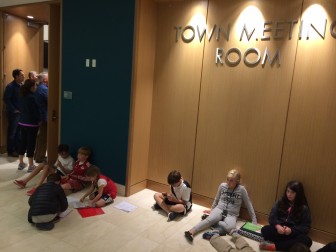 The Town Meeting Room at Town Hall was packed and spilled into the hallway outside during a public hearing on a proposed renovation and expansion of Saxe Middle School, on Oct. 21, 2015. Credit: Michael Dinan
