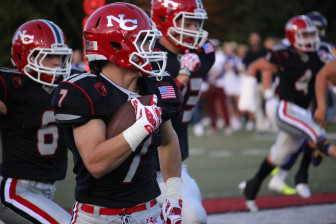 Ryan O'Connell with a pick-six in New Canaan's 55-12 win over Westhill, Oct. 5, 2015. Credit: Terry Dinan