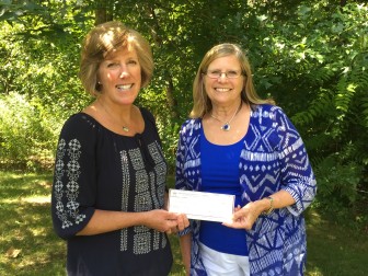  Allison Murphy, PCE scholarship winner, receives a scholarship from P.E.O. Chapter N member Cathy Townsend. Contributed