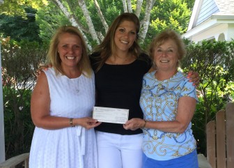 P.E.O. Chapter N PCE chairman, Laura Dijs presents a check to Kristin Santella, PCE scholarship winner, with Kathy Johnson, P.E.O. Chapter N member. Contributed