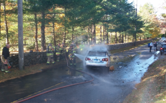 Firefighters put out a car on fire following a 3-car accident on Frogtown Road on the morning of Oct. 30, 2015. Photo published with permission from the owner