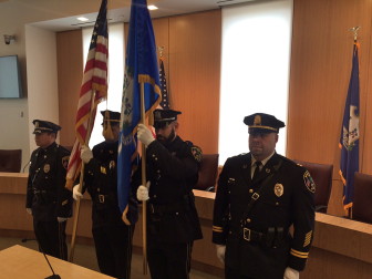 The New Canaan Police Department Color Guard, L-R Officer Jason Kim, Sgt. Aaron LaTourette, Officer Christopher Dewey, Capt. John DiFederico, at the Veterans Day ceremony in Town Hall on Nov. 11, 2015. Credit: Michael Dinan