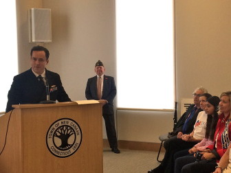 U.S. Navy Lt. Todd Kniffen addresses those gathered for the Veterans Day ceremony in Town Hall on Nov. 11, 2015. Credit: Michael Dinan