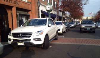 A Mercedes parks in the crosswalk on Elm Street on Nov. 19, 2015. Contributed