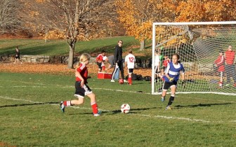 Katie Quill beats the goalie during New Canaan’s win on Sunday against Trumbull. Contributed