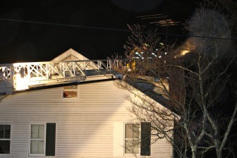 New Canaan Fire Company on the scene at a chimney fire on East Maple Street, December 16, 2015. Credit: Terry Dinan