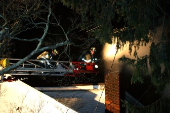 New Canaan Fire Company on the scene at a chimney fire on East Maple Street, December 16, 2015. Credit: Terry Dinan