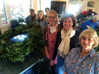The New Canaan women who led this year's effort to create the wreaths that adorn several major buildings, L-R: New Canaan Beautification League President Faith Kerchoff, New Canaan Garden Club President Jane Gamber, NCGC wreaths Chair Maryjane Markey and NCBL wreaths Co-Chair Liz Orteig. Not pictured: NCBL wreaths Co-Chair Sharon Johnson. Credit: Michael Dinan