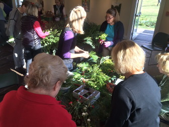 Members of the New Canaan Beautification League and New Canaan Garden Club collaborate to create the wreaths that adorn several major buildings in town. Here they are on Dec. 3, 2015 at the New Canaan Nature Center. Credit: Michael Dinan