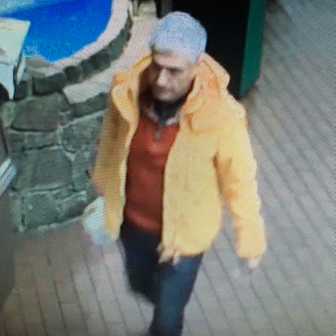 Video surveillance from Dec. 2 shows this man stealing a New Canaan woman’s $2,000 Prada purse and $4,800 Gucci wallet—as well as credit cards and cash—from a shopping cart at Stew Leonard’s in Norwalk. Photo courtesy of the Norwalk Police Department