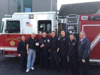 L-R: Firefighter Kevin Vetti, Weed and Duryea employee Barry Coleman, firefighter Jim Pickering, firefighter Brian Doane, firefighter Michael Jackson, firefighter Patrick Moley and Captain Michael Socci.