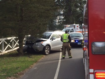 A woman suffered minor injuries following a single-car accident near 528 Main St. on the afternoon of Jan. 7, 2016. Credit: Michael Dinan