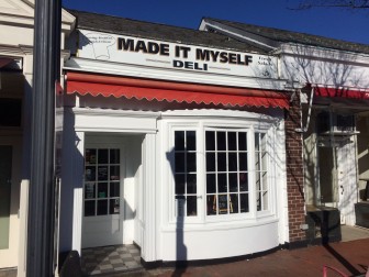 The old "Chicken Joe's" sign has come down, revealing its predecessor's sign in the Elm Street space. New Canaan Chicken will open as early as Thursday. Credit: Michael Dinan