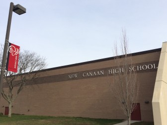 A banner adorns a light post outside New Canaan High School. Credit: Michael Dinan