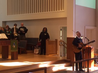 Former Center School teacher Bruce Taylor plays guitar with the Serendipity Chorale, here leading the congregation at United Methodist Church in New Canaan in "Amazing Grace" on Jan. 18, 2016. Credit: Michael Dinan