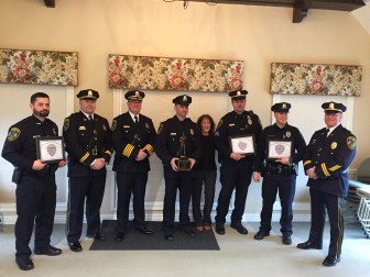 L-R: Officer Bryan Connolly, Capt. John DiFederico, Chief Leon Krolikowski, Officer George Caponera, Pat Wood, Sgt. Kevin Casey, Officer Thomas Callinan and Capt. Vincent DeMaio at a Feb. 23, 2016 awards ceremony. Elizabeth Oei photo