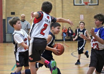 Ryan Connelly (#11), Cooper Dinan (#2) and Matt Salmini (#23) collapse on defense. Credit: Terry Dinan