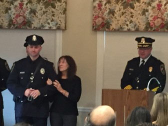 New Canaan Police Officer George Caponera (L) receives the Lt. Steven. W. Wood Memorial 2015 Officer of the Year Award. Pat Wood, widow of the 33-year NCPD veteran, stands with Caponera. Police Chief Leon Krolikowski at right. Elizabeth Oei photo