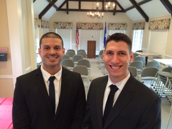 Sebastian Obando (L) and Matthew Blank (R) prior to their formal swearing-in as New Canaan police officers by Town Clerk Claudia Weber at Lapham Community Center on March 24, 2016. Credit: Michael Dinan