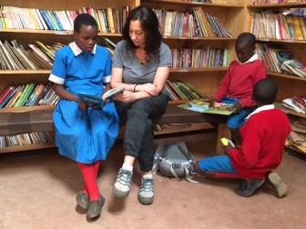 Carolynn Kaufman reads with FAFU students in Kibera.