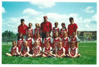 From Fifth Grade to Senior Year: Pictured here as lacrosse teammates in the fifth grade are Catherine Granito (center, holding the crossed sticks), Kylie Murphy (front row, far right), Mia Carroll (2nd row, far right) and Katharine Freiberg (front row, far left). Credit: Mary Freiberg