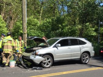 The aftermath of an accident on Old Stamford Road just south of Richard's Lane in New Canaan, on May 16, 2016. Credit: Michael Dinan