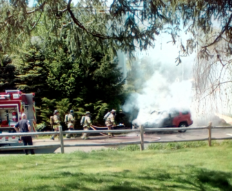 Firefighters respond to a car fire at Oak and Main Streets in New Canaan on May 11, 2016. EK photo 