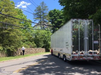 A tractor-trailer snagged low-hanging wires at Elm and Weed Streets in New Canaan on June 7, 2016. Credit: Michael Dinan