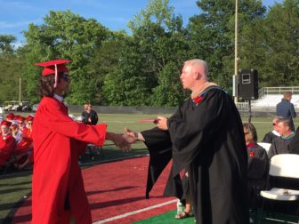 NCHS senior John Bemis receives his diploma at Dunning Field on graduation day, June 15, 2016. Credit: Michael Dinan