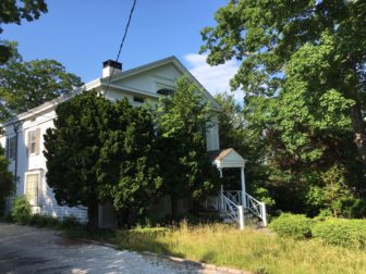 The long-vacant Greek Revival-style home at 4 Main St. in New Canaan, on June 23, 2016. Credit: Michael Dinan