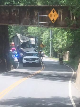 A tractor-trailer struck the railroad overpass on Route 106 in New Canaan on Monday, June 27, 2016. Photo published with permission from its owner