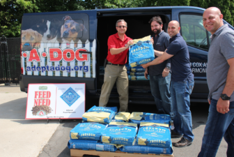 Adam Jacobson, Ari Jacobson and Josh Roth from Pet Pantry Warehouse, assist Brian Gordiski from Adopt A Dog in loading a donated pallet of Blue Buffalo dog into the shelter’s van. Adopt A Dog feeds the entire shelter population for free as a result of Pet Pantry’s Feed the Need program.. June 27, 2016 Credit: Sadie Smith