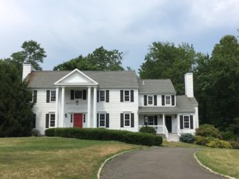 This 1982-built, four-bedroom Colonial at 127 Hoyt Farms Road includes 4,428 square feet of living space and sits on two acres. It sold in June 2016 for $1,832,500. Credit: Michael Dinan