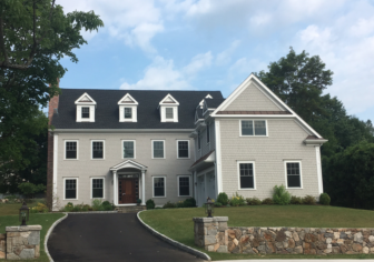 This 2015-built, Colonial-style 5-bedroom home at 66 Field Crest Road includes 5,302 square feet of living space and sits on .51 acres. It sold in June 2016 for $2.1 million. Credit: Michael Dinan