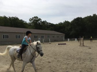 Troopers in the outdoor riding ring at New Canaan Mounted Troop. Credit: Michael Dinan