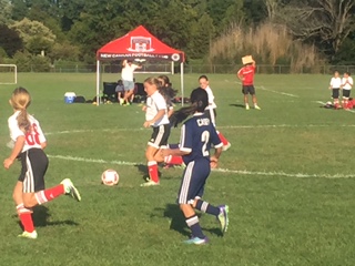The Mighty U10 Reds push the play forward again Wilton. Contributed